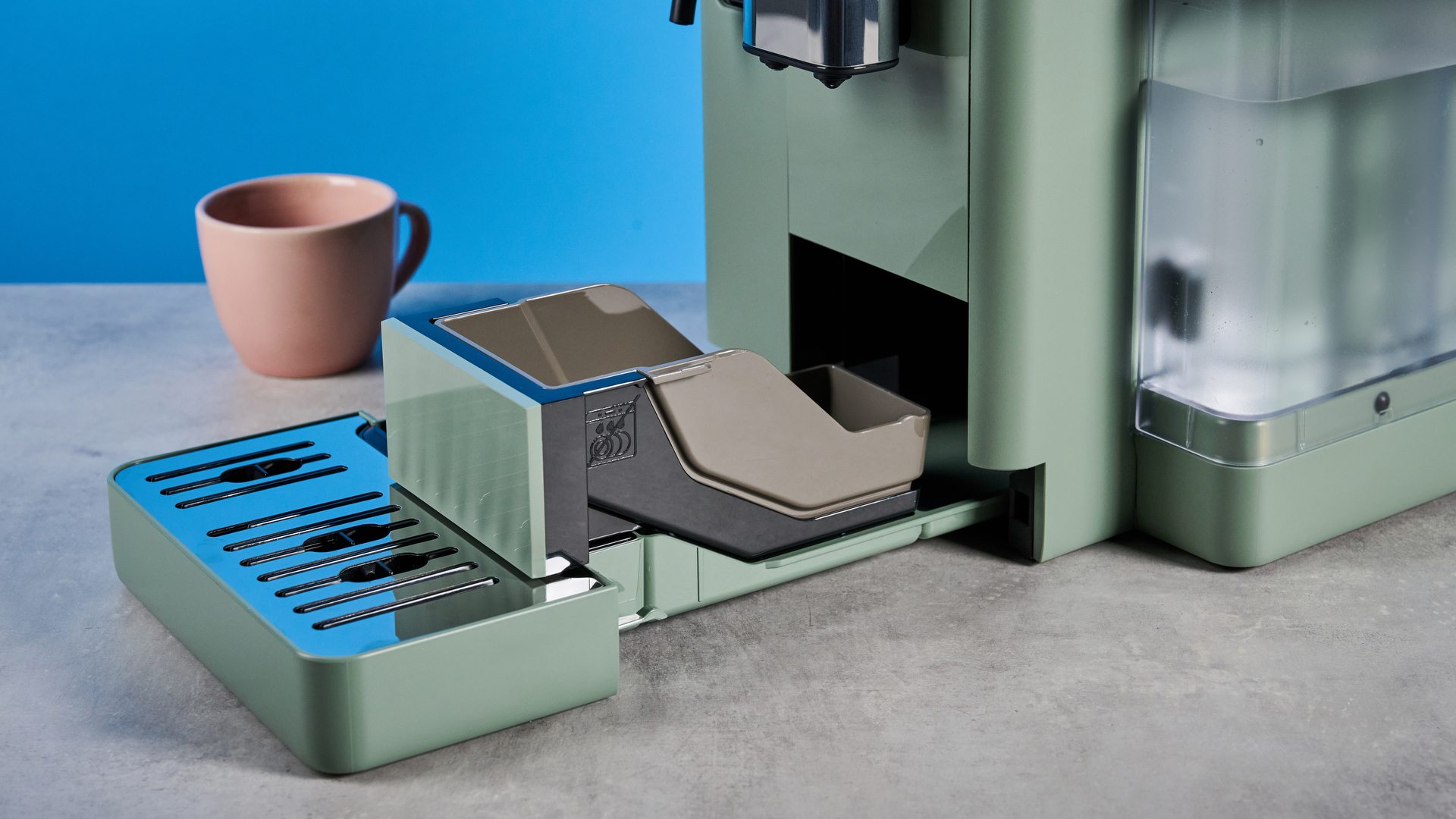 the de'longhi rivelia automatic superautomatic coffee machine in sage green with a bright LED screen, two interchangeable bean hoppers, an automatic milk frother, and a huge range of coffee recipes
