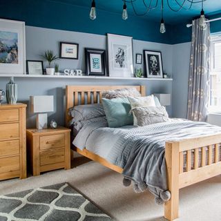 bedroom with light blue wall and dark blue ceiling