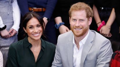 Meghan Markle and Prince Harry smile for the camera 