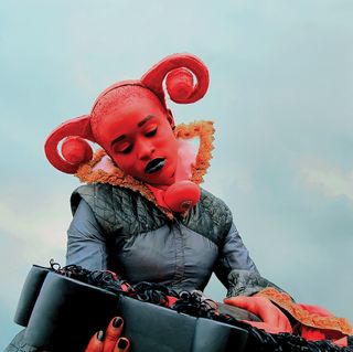 woman wearing devil prop