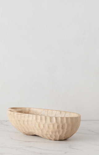 dimpled wood bowl in pale brown