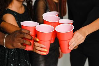 Spiking in clubs: A group of university friends cheers red cups