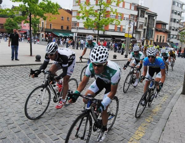 Caja Rural team members ride in support of their teammate and race leader Javier Moreno.