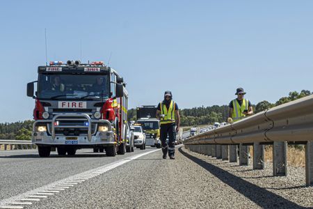 Truck searching for capsule on highway.