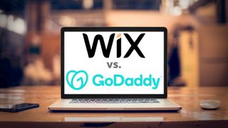 Wix and GoDaddy logo on a laptop screen