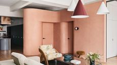 pink curved internal doors within open plan apartment