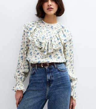 Image of white and blue floral blouse