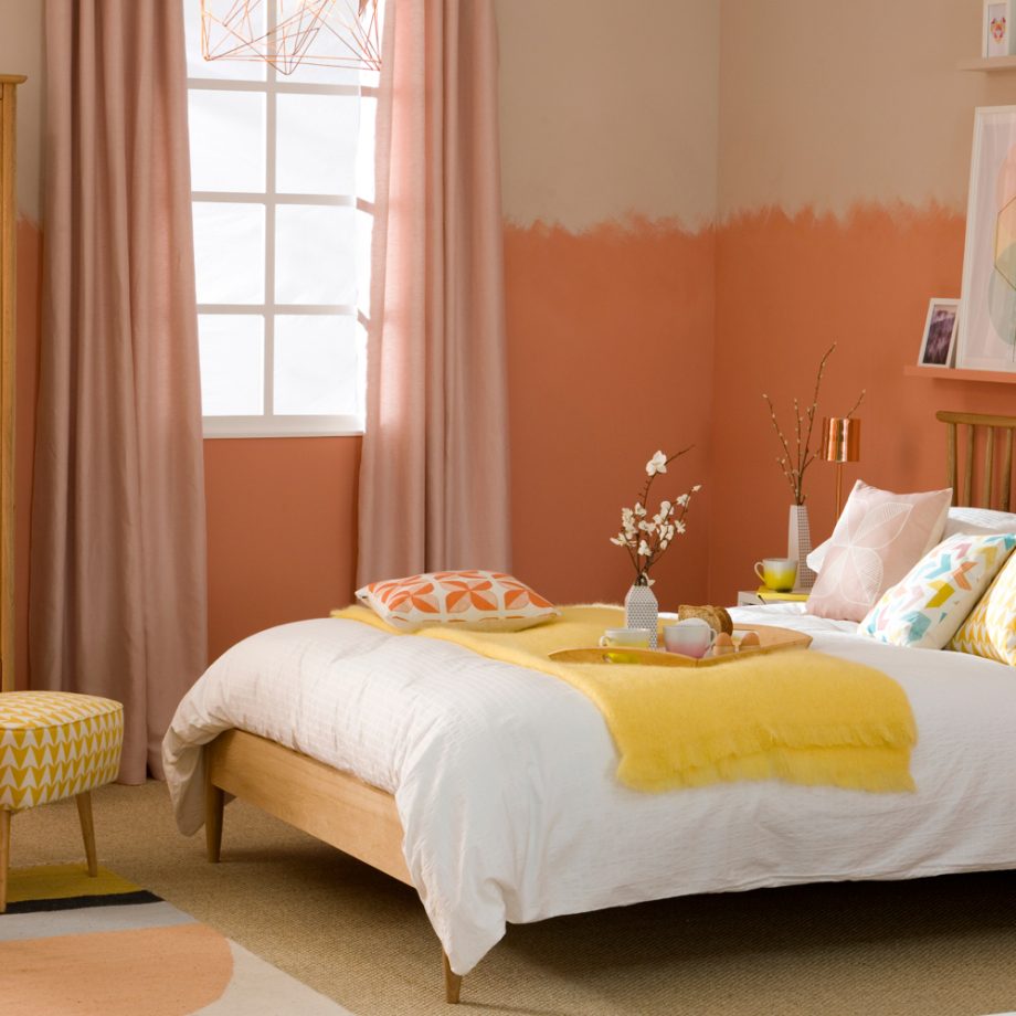 peach bedroom with yellow and blue accents