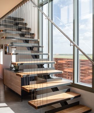 Metal staircase railing idea with floating wooden stairs