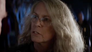 Jamie Lee Curtis looking concerned in Halloween (2018).