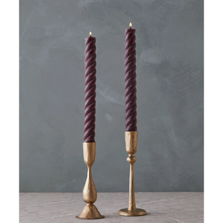 deep plum twisted candles in gold candlesticks