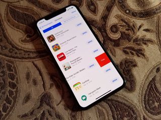 iPhone XS with purchased apps hide button