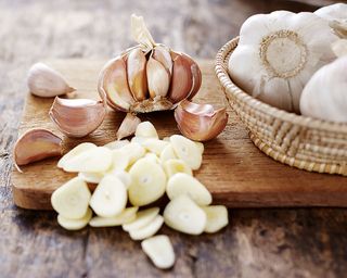 Garlic cloves on a chopping board