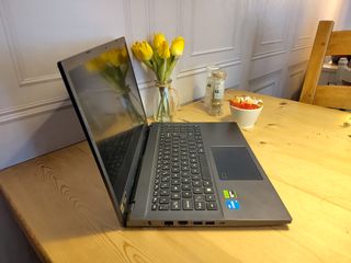 An Acer Aspire 7 sitting on a wooden desk