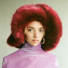 model wearing an Emma Brewin fuzzy bucket hat