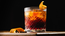 Negroni with a twist of orange on board. 