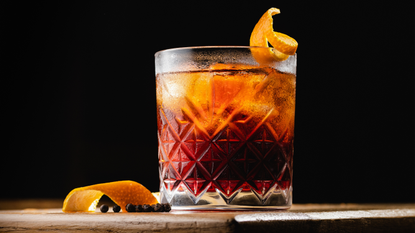 Negroni with a twist of orange on board. 