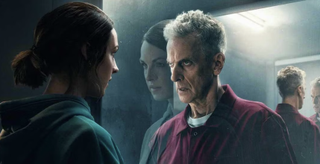 Jessica Raine and Peter Capaldi face each other with their reflections mirrored