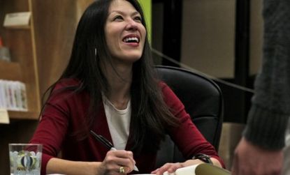 Amy Chua signs copies of her controversial book last January: The "Tiger Mom" may gain a more supportive following now that daughter Sophia has been accepted to ivy league schools.