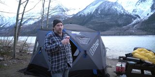 Steve Wallis camping in an ice fishing hut