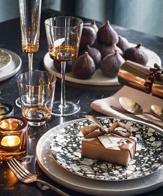 Christmas place setting on decorated table with figs
