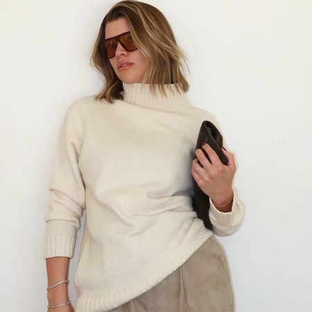 Sofia Richie Grainge wearing SRG suede pants and a cream turtleneck.