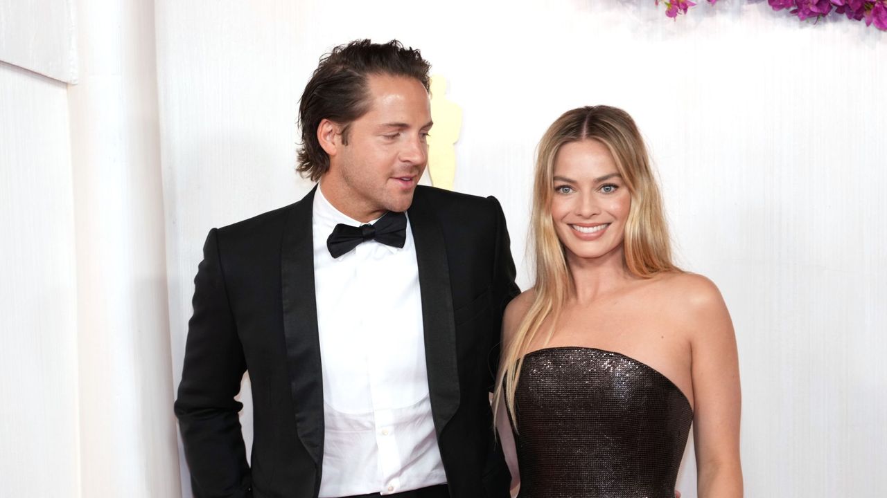 Margot Robbie and Tom Ackerley attend the 96th Annual Academy Awards in 2024