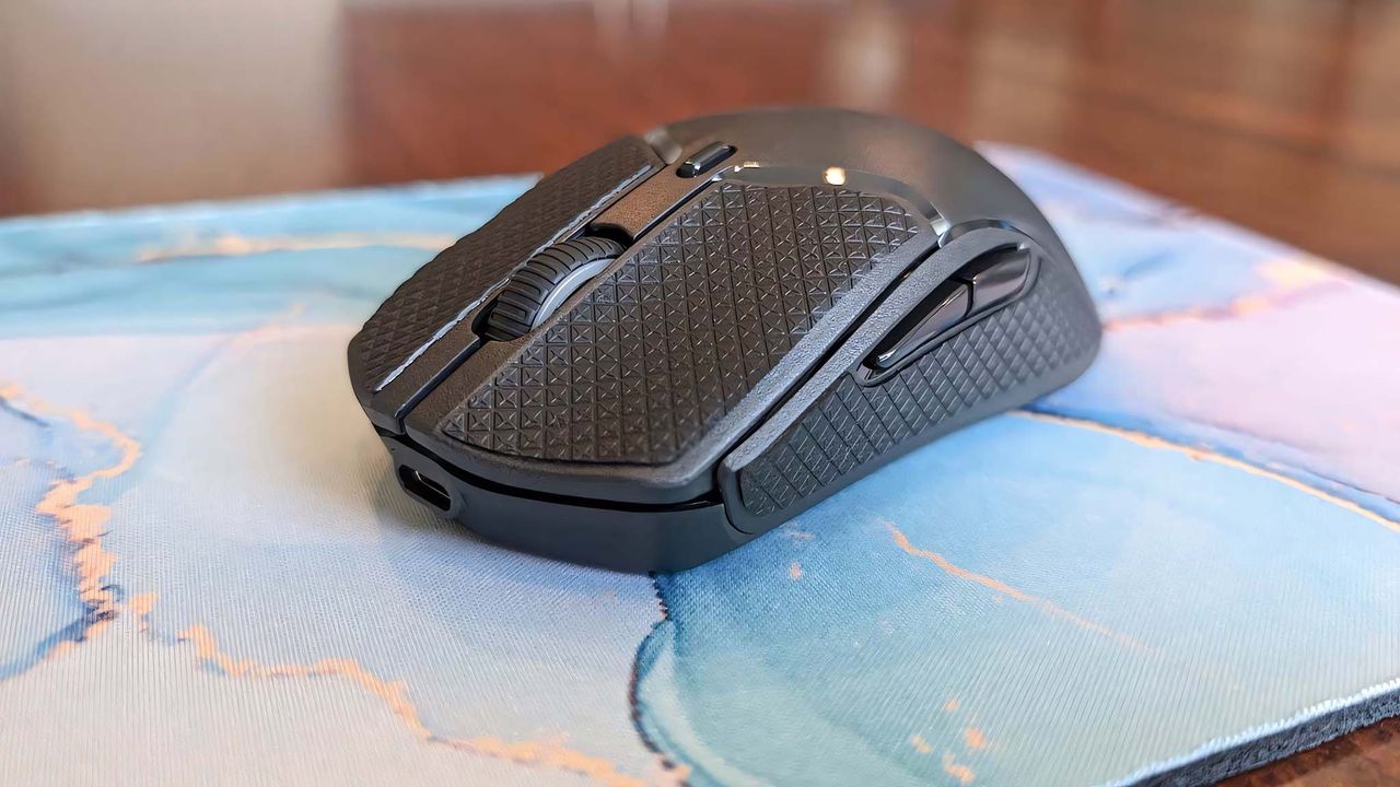 HyperX Pulsefire Haste 2 Mini Wireless with grips attached.