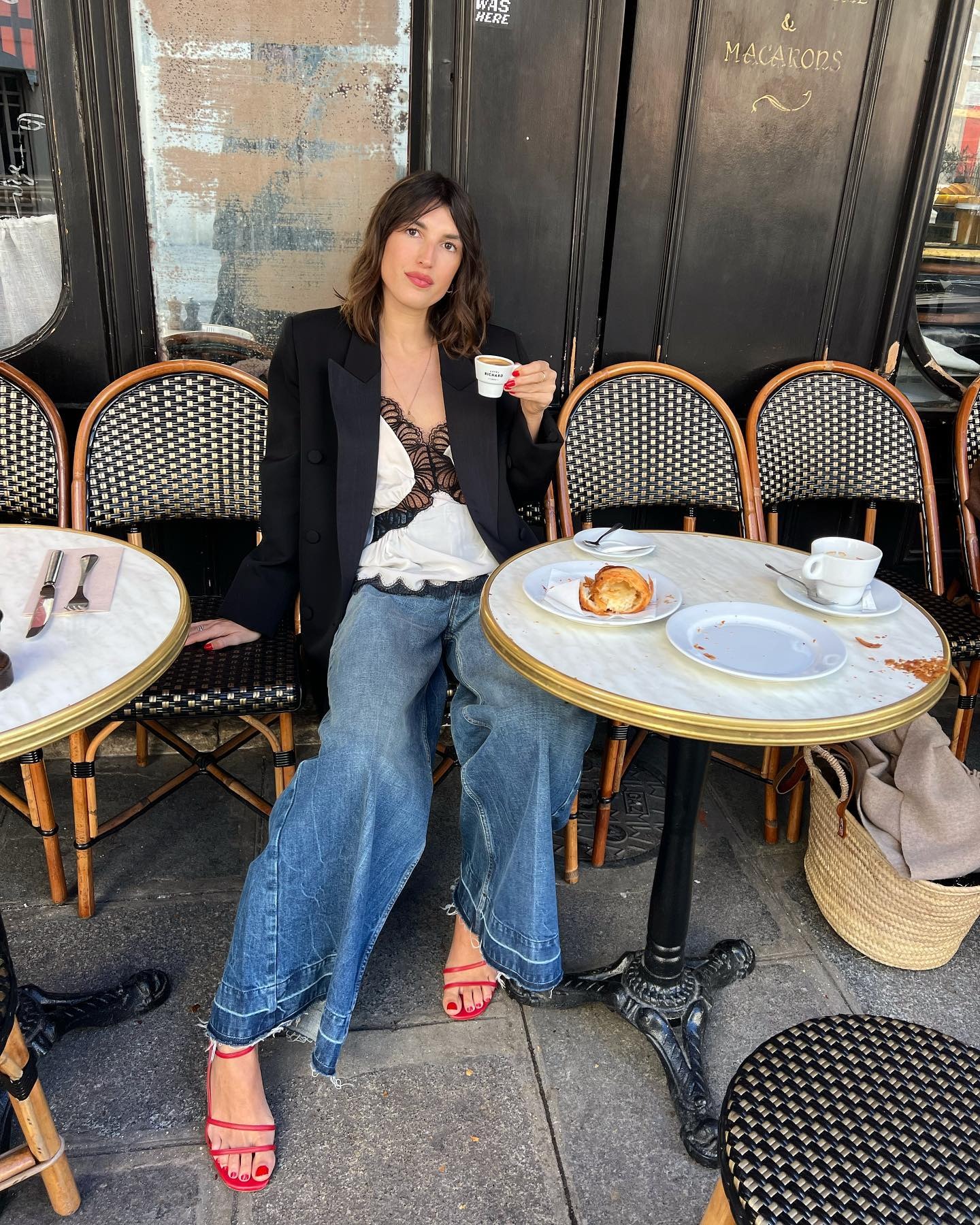 Photo of Jeanne Damas at a French cafe
