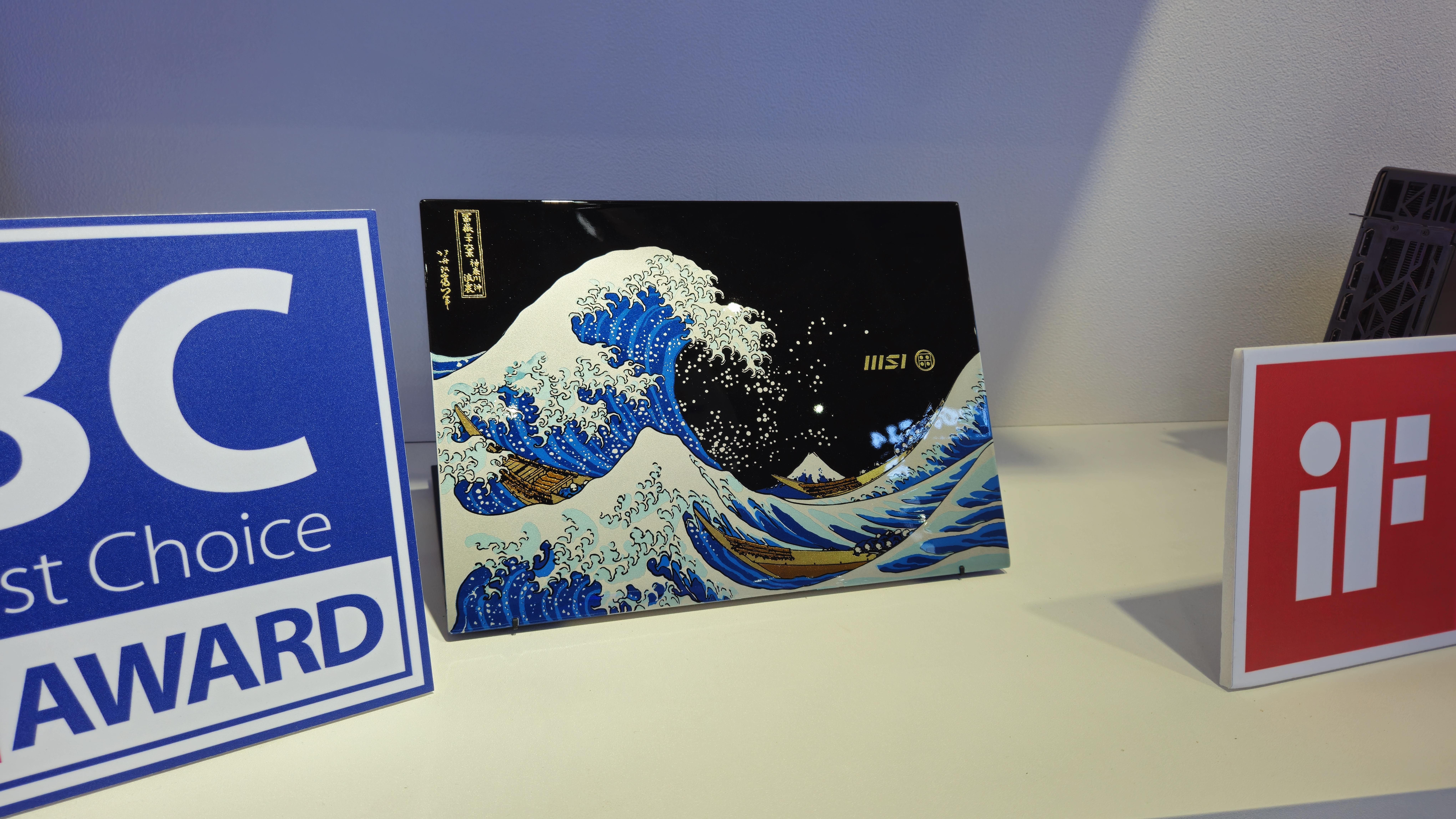 An MSI Prestige 13 AI+ Ukiyo-e Edition laptop featuring a laquered lid inspired by The Great Wave off Kanagawa by Katsushika Hokusai