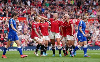 Manchester United’s Alessia Russo (centre) celebrates her second goal at an excited Old Trafford