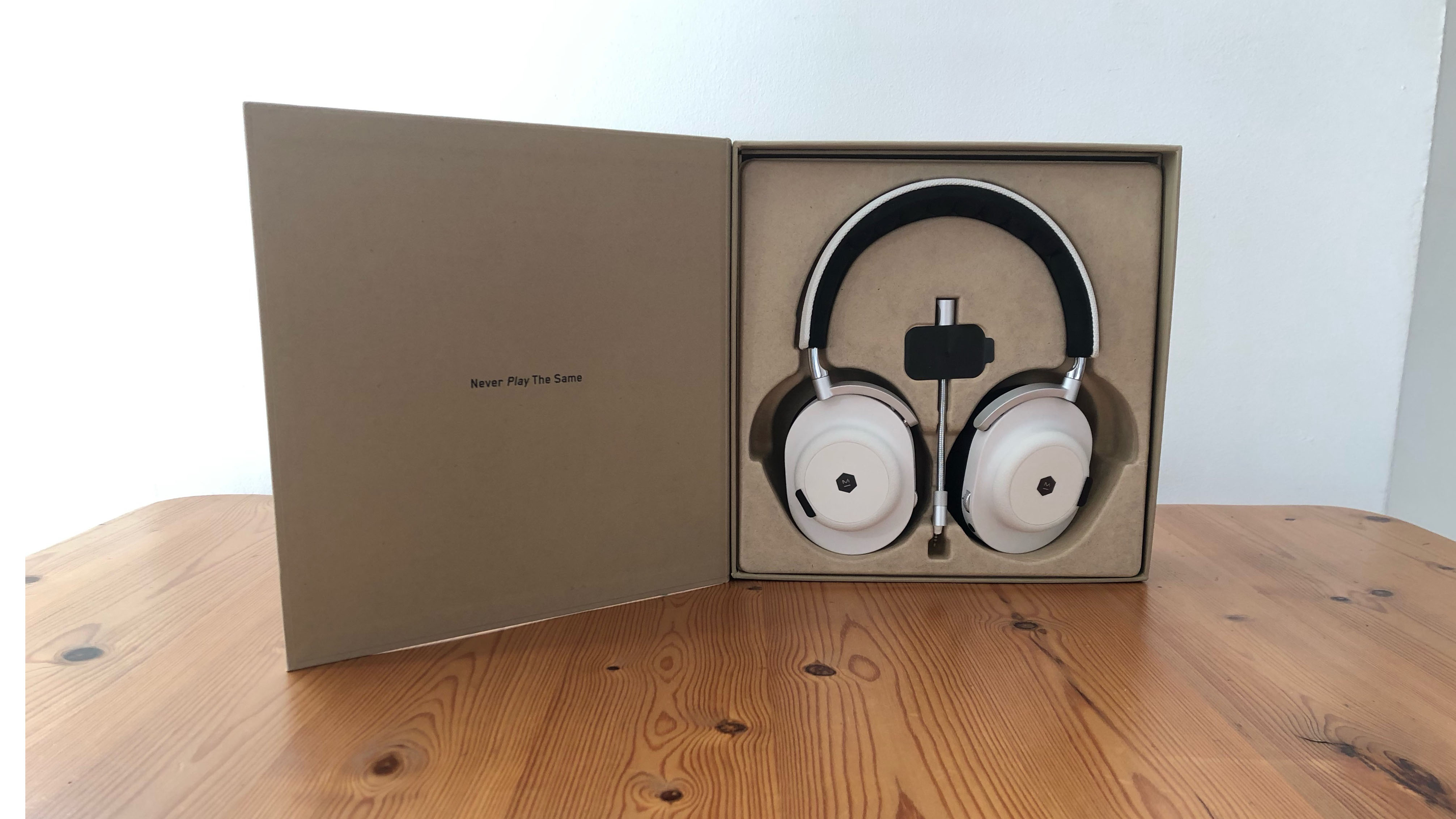 Master Dynamic MG20 headset on wooden surface