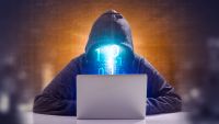 Figure in front of a PC