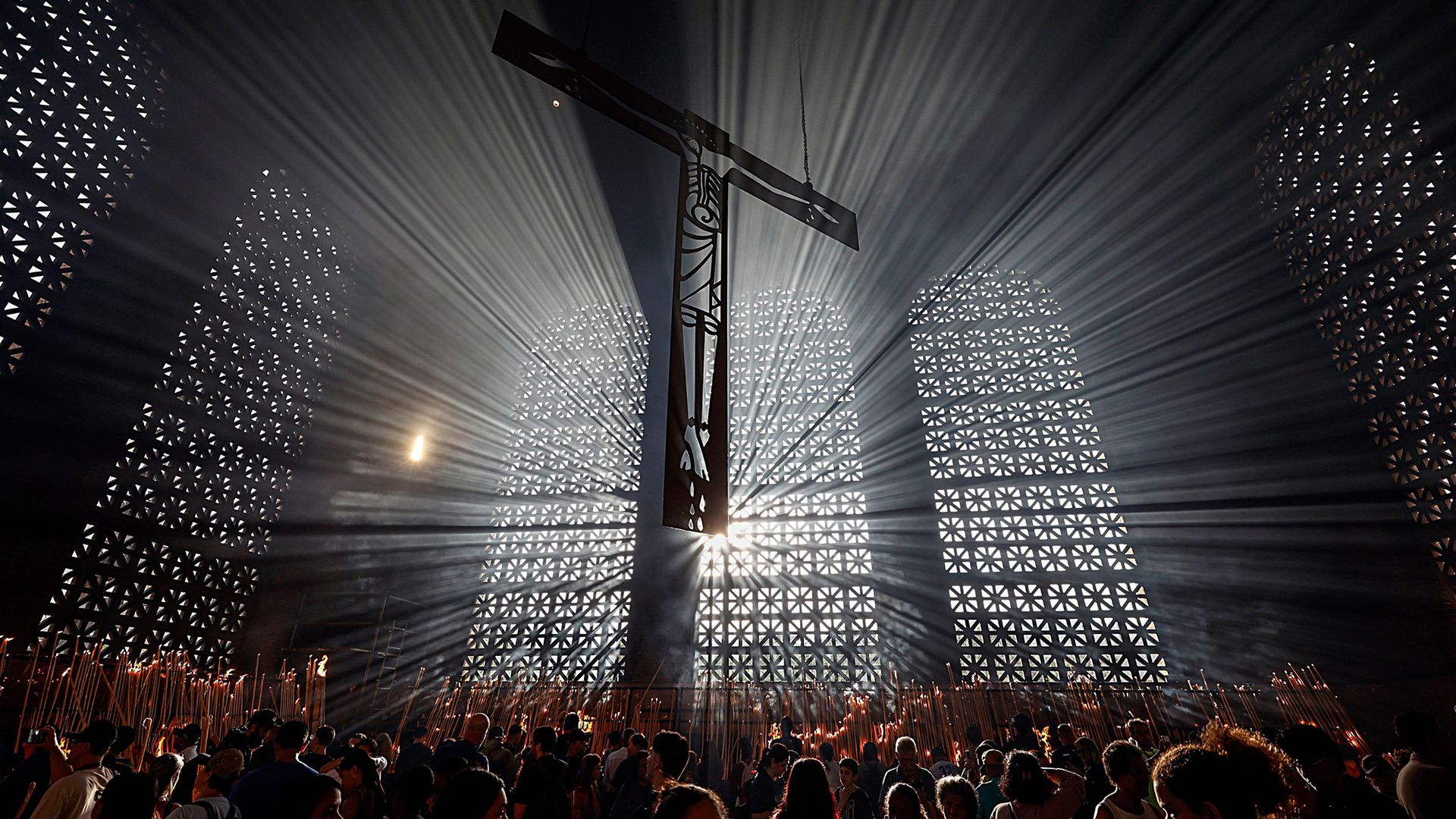 Parishioners light candles during feast day celebrations at the Basilica of Our Lady of Aparecida in the city of Aparecida, Brazil