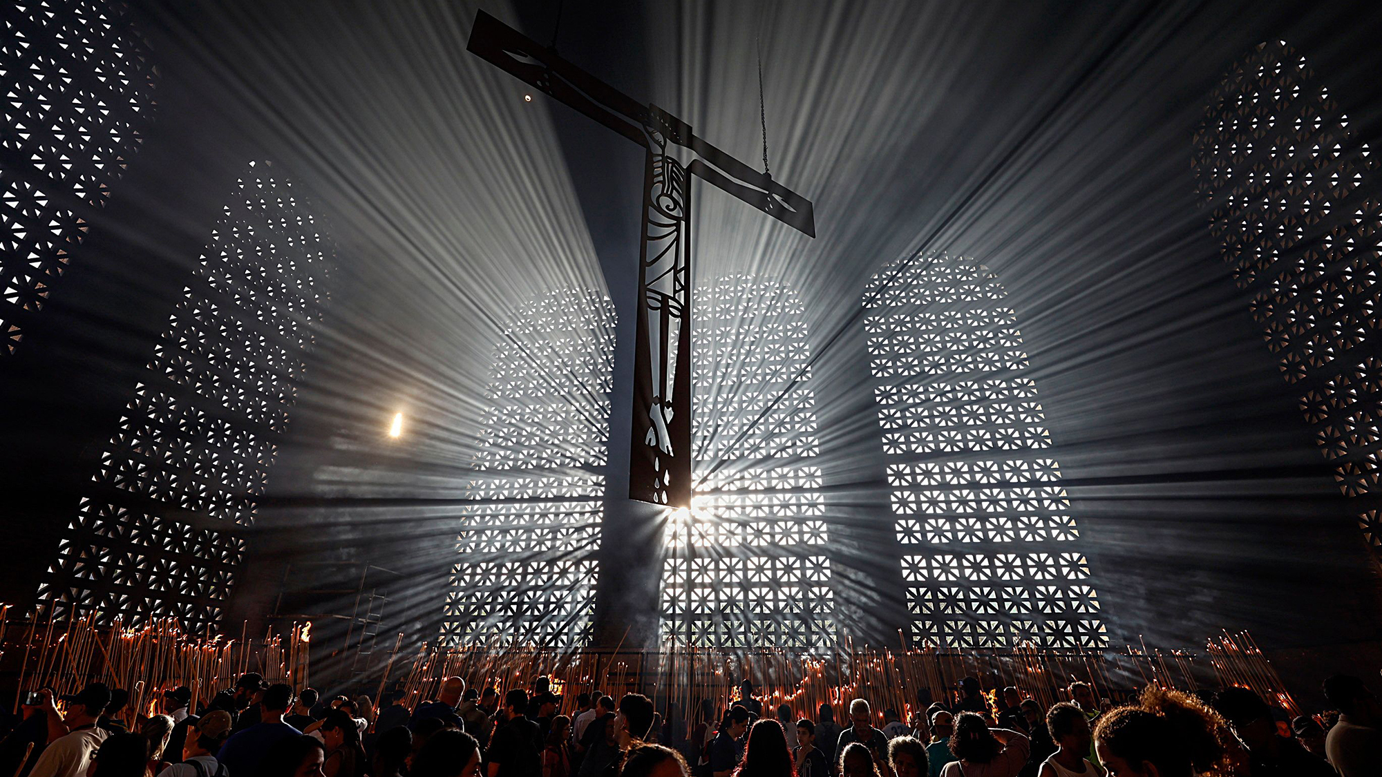 Parishioners light candles during feast day celebrations at the Basilica of Our Lady of Aparecida in the city of Aparecida, Brazil