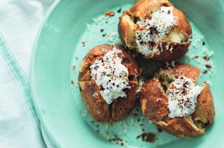 the best ever baked potatoes on a blue plate