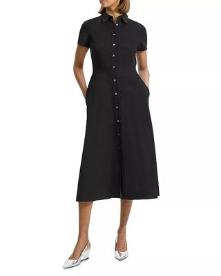 Model wearing black button down polo dress