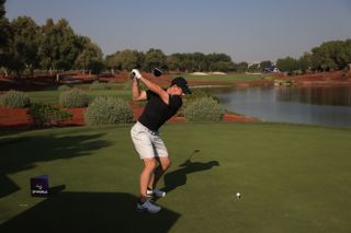 Rory McIlroy pictured hitting a drive ahead of the DP World Tour Championship