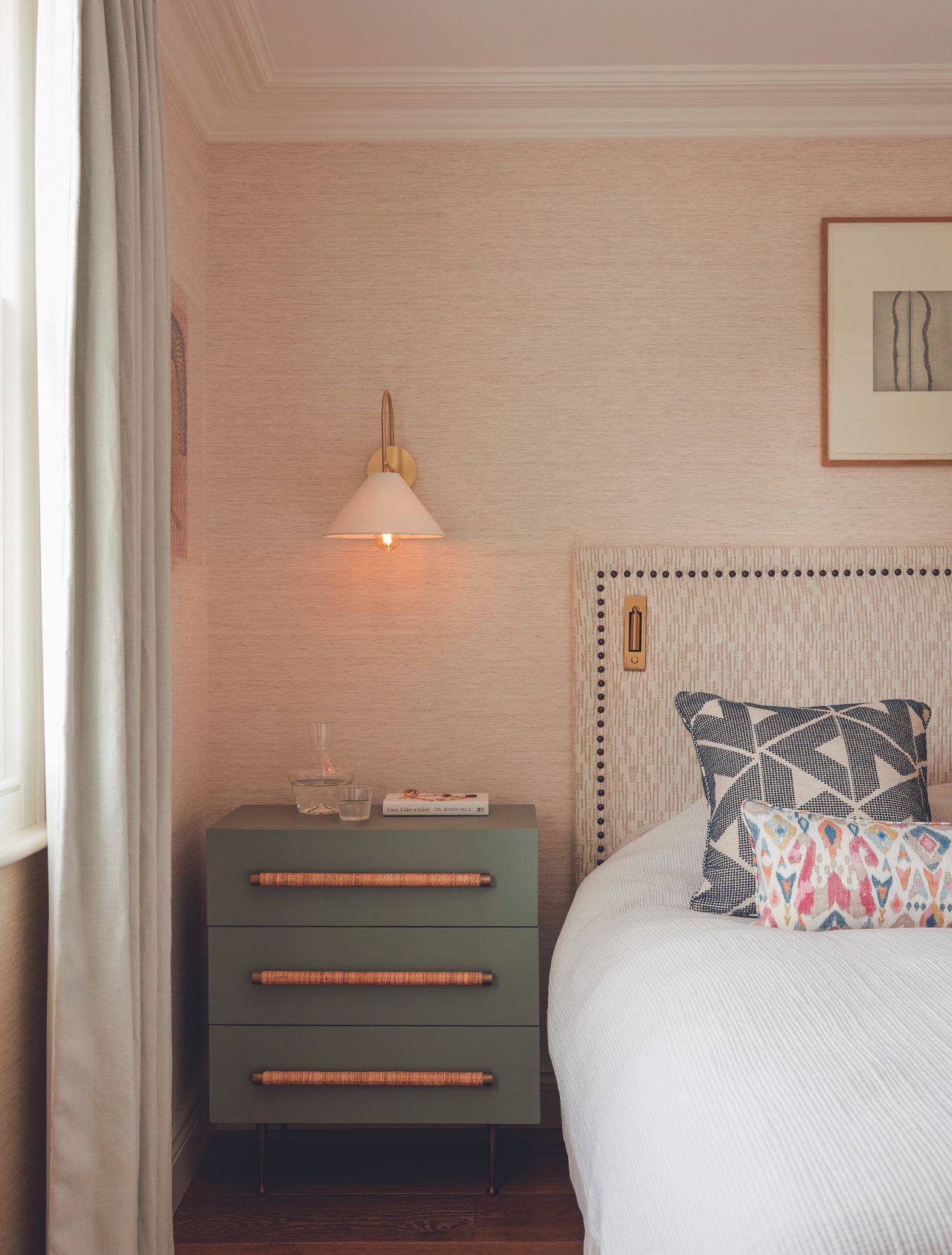 A detail shot of the bedside table in this pink tinted bedroom