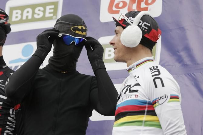 Taylor Phinney (left) does his best to stay warm as BMC is presented to the crowd