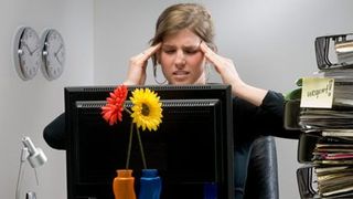 woman at desk stressed