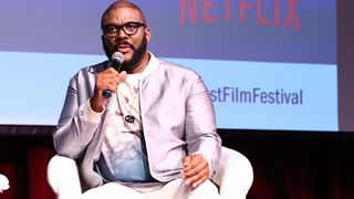 Tyler Perry sitting for a Netflix panel discussion