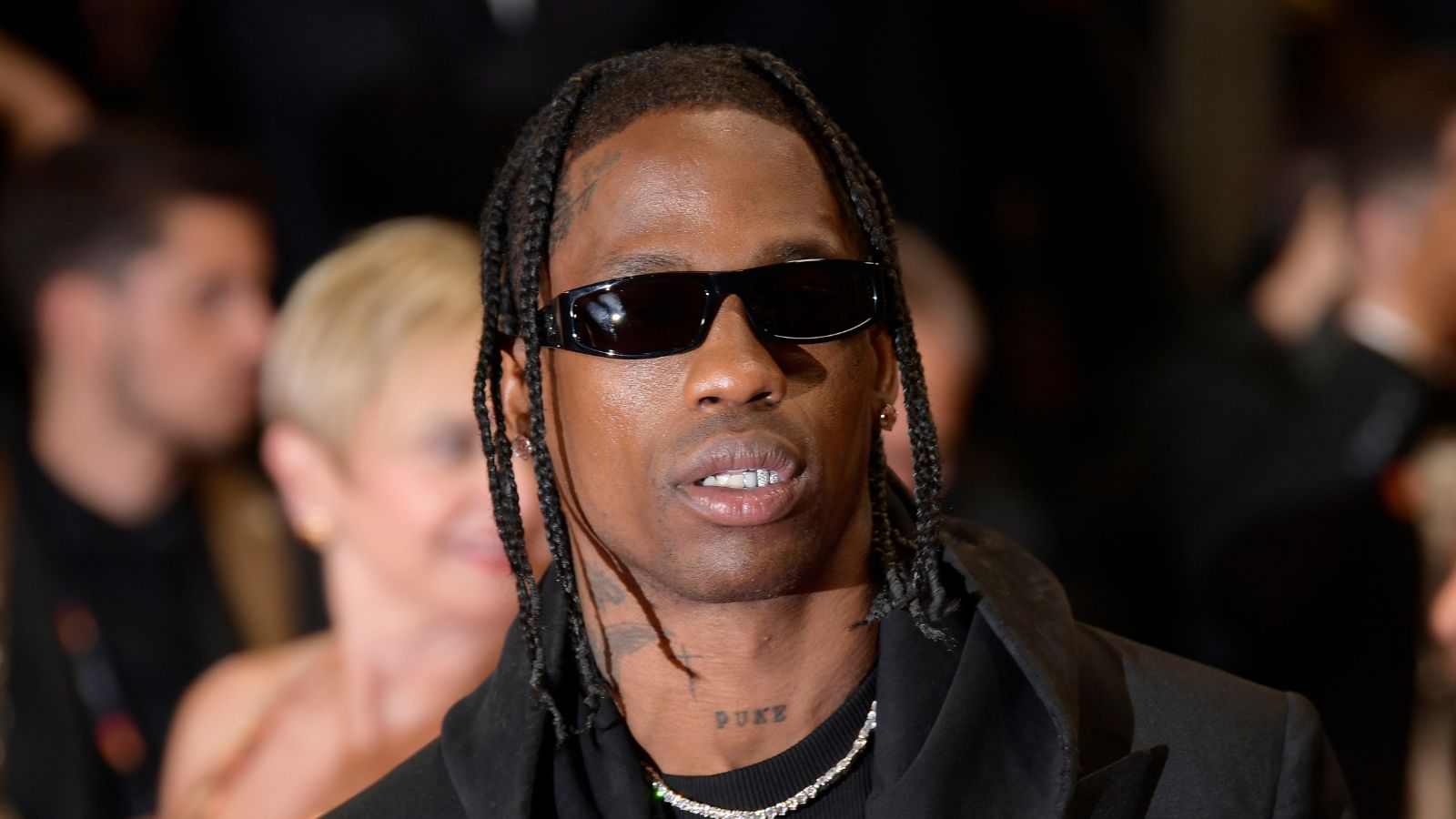 travis scott on a blurred background of people