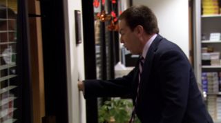 Andy punching a hole in the wall in The Office