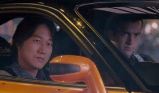 The Fast and the Furious: Tokyo Drift Han and Sean facing the camera in their ride