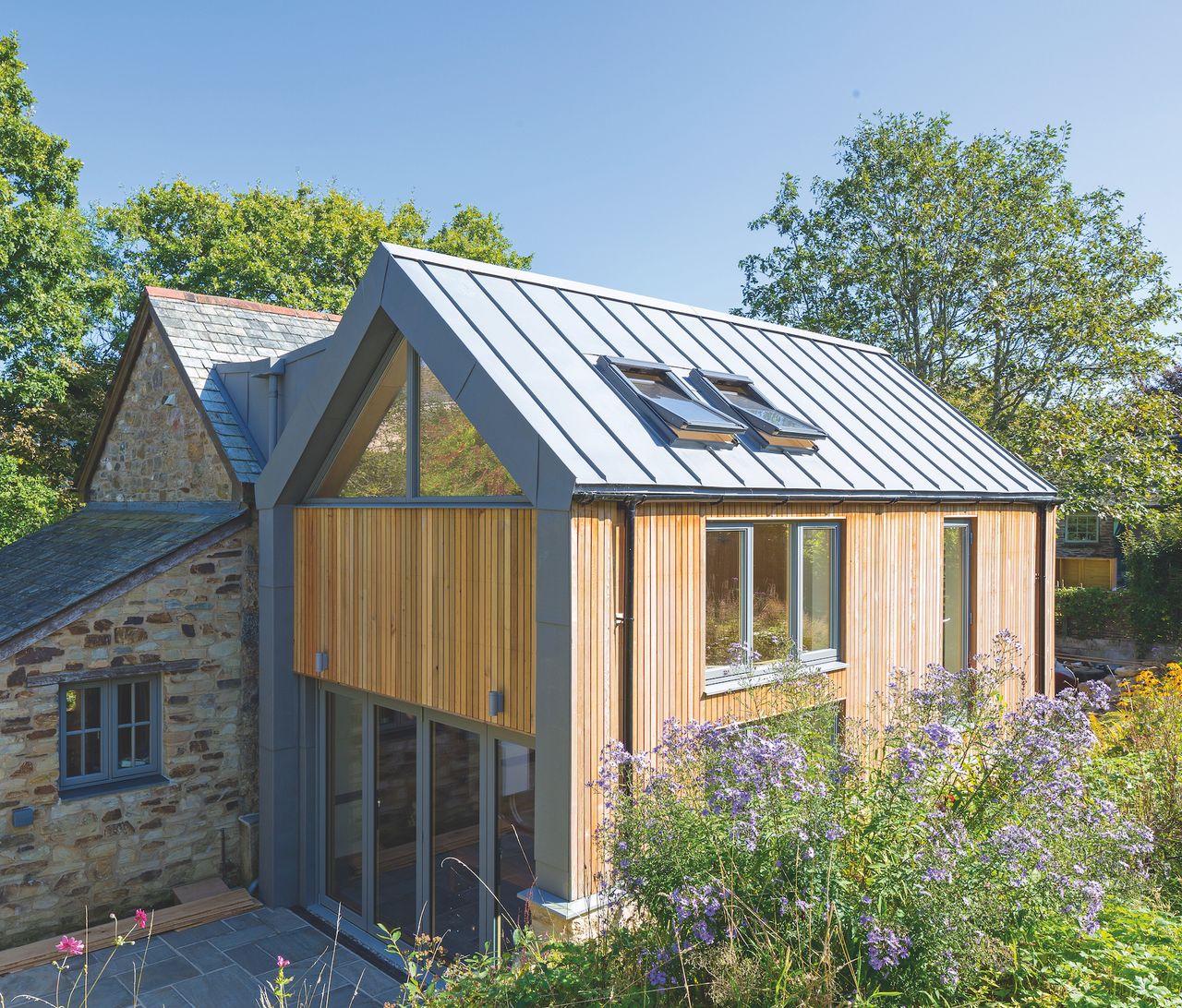 two storey extension with timber cladding and zinc roof