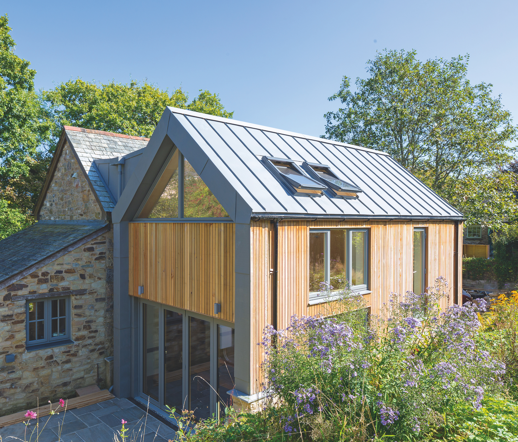 two storey extension with timber cladding and zinc roof