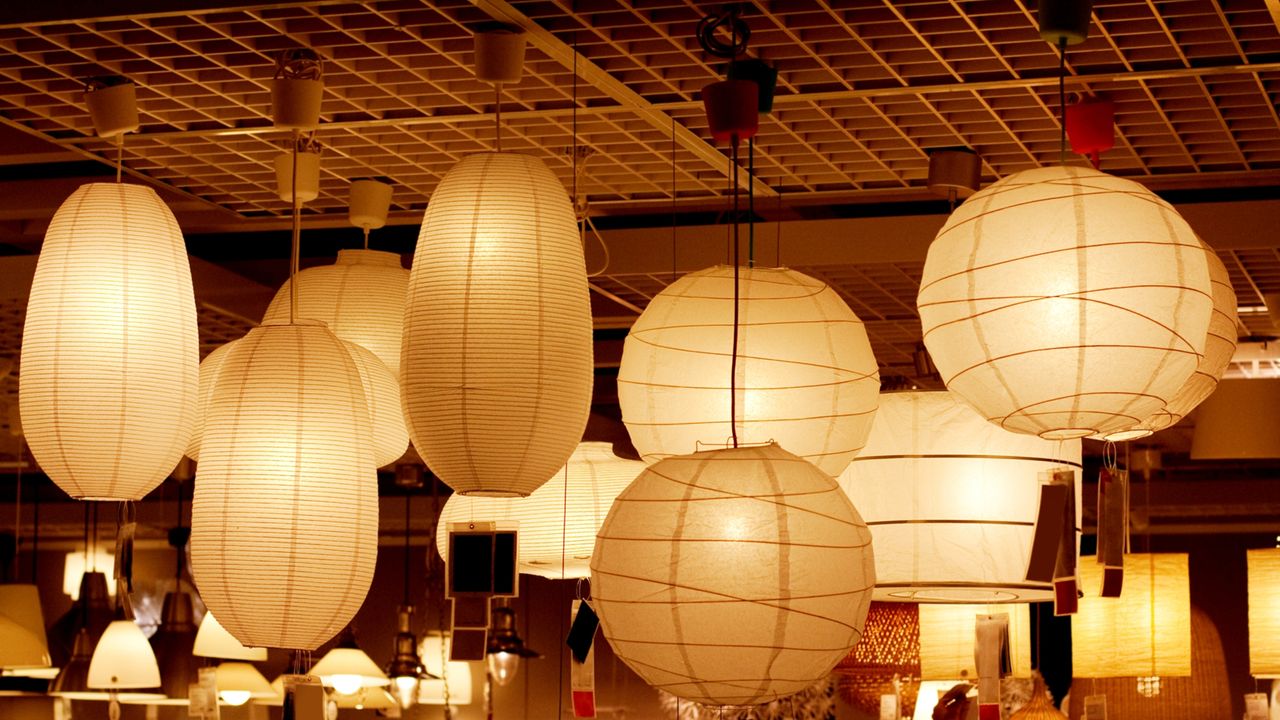 Assortment of paper lamps hanging from the ceiling