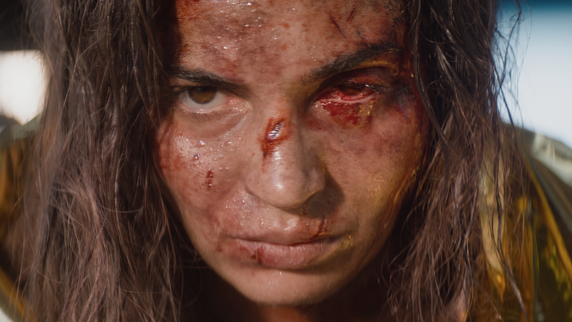 Alice with cut nose and busted eye in Evil Dead Burn