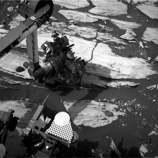 Curiosity's robotic arm is rotated to show its drill in this navcam photo from Mars on Feb. 15.